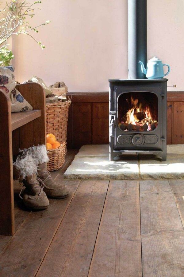 Charnwood Country 4 Woodburning Stove - The Charnwood Country 4 woodburning stove is the smallest model in the wood & multi-fuel room heating collection, yet still incorporates the ingenious features of the larger stoves. It is a neat, sturdy, yet graceful little fire and with a rated output of 4.8kW can be installed in certain situations, without the need for external air. The single door gives a complete and clear view of the fire and features a spinning primary air wheel for optimum control over the burning rate. In spite of its size, the Charnwood Country 4 takes a decent sized log length of 330mm (13") making it a very popular choice in the small stove market.