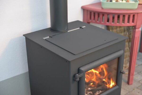 Esse Garden Stove Outdoor Heater & BBQ - <p style="vertical-align: baseline; margin: 0cm 0cm 19.2pt 0cm;"><span style="font-family: &quot; color: #4e5768;">High quality outdoor stove by master stove makers ESSE with BBQ feature. The Esse Garden stove comes complete with a hotplate and a grill for fantastic wood fired cooking at its best. In stove mode with the hot plate swapped over for the grill this makes an ideal solution for keeping toasty on cooler summer evenings. Includes chimney and quick release placement wheels to assist with relocation in the garden.</span></p>