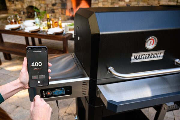 Masterbuilt Digital Charcoal Grill/Smoker 1050 - With the Gravity Series? 1050 Digital Charcoal Grill + Smoker by Masterbuilt, you can smoke, grill, sear, bake, roast and so much more. Set the temperature on the digital control panel or your smart device and the DigitalFan? maintains the desired cooking temperature. The GravityFed? charcoal hopper holds up to 8 hours of charcoal and gravity ensures you have constant fuel to the fire. The reversible smoke + sear cast-iron grates and FoldAway? warming + smoking racks add up to a total of 1050 square inches of cooking space. Master the art of charcoal grilling and smoking with Masterbuilt.