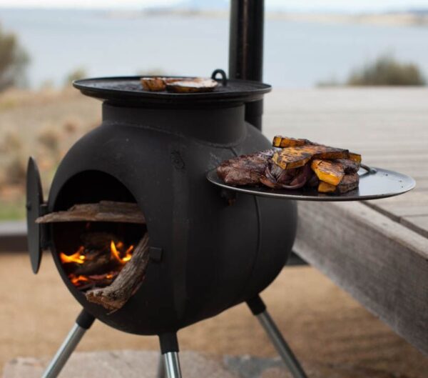 Ozpig Series 2 Portable Outdoor BBQ & Heater Bundle - Ozpig Series 2 Portable Outdoor BBQ & Heater Bundle The Ozpig, which resembles a small pig on legs, has a specially designed chimney and is used with the door in an open position to provide the enjoyment and ambience of a contained fuel efficient, open fire. In recent years the developers' passion for cooking kicked in and the unit has been further developed to double as a multi purpose cooking station to further complement the original heating function.<strong> </strong> <strong>With this bundle you get the following items FREE </strong> <ul> <li>10kg Bag of Lumpwood Charcoal</li> <li>1 x Bag of Kiln Dried Logs</li> <li>1 x Box of Long Matches</li> <li>1 x Box of 50 Flamers</li> </ul>  