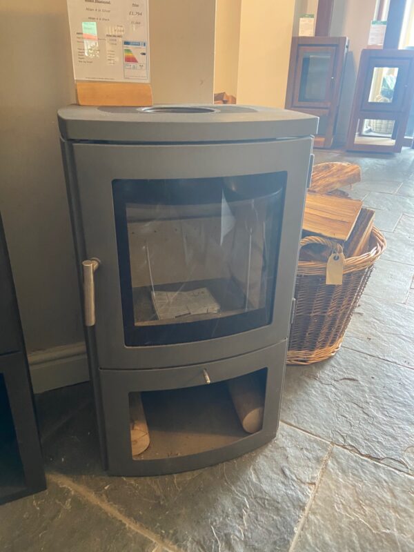 Chesney's Milan 4 in Silver - Ex-Display - The Chesneys Milan 4 Series wood burning stove is DEFRA exempt for use in smoke control areas which means it can be safely and legally used to burn logs in all major cities and towns throughout the UK. 4.6kW Output 80% Net efficiency rating