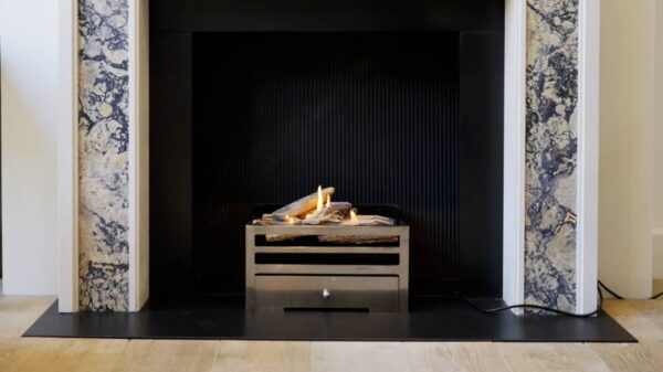 Chesney's Alchemy FB18 Bioethanol Soho Firebasket - The Alchemy FB18 has been designed for installation with a free-standing fire basket. For a contemporary look the FB18 can be installed with its polished steel top plate left visible and a ribbon flame effect. Alternatively, the FB18 is available with a detachable steel plate displaying hand painted ceramic logs that successfully emulate the beauty and appearance of a real log fire, achieving an outstandingly realistic appearance as the flames lick around the logs. The steel log plate can be lifted easily on and off for the purpose of re-fueling.