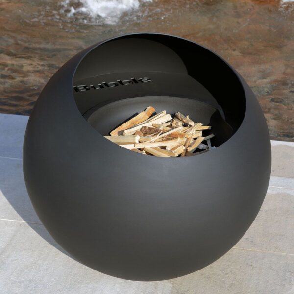 Focus Bubble - Garden Firepit - The Bubble is a contemporary wood-burning fire bowl that brings its stylish originality to any outdoor space. Its open fire provides the perfect centrepiece to extend long summer nights or take the chill off autumn evenings. The brasero’s simplicity and sophistication, a hallmark of Focus design, as well as its performance make it suitable for a wide range of exterior settings, from gardens to roof terraces to patios. Measuring 700 mm in diameter, this wood burning fire pit is equipped with two rear caster wheels so it can be easily moved on a flat surface. The basin can be removed for maintenance and cleaning. The model’s anti-corrosion finish is designed to withstand outdoor conditions so it will keep its eye-catching look over the seasons.   <strong>Please allow 10-12 weeks for delivery from placing your order </strong>